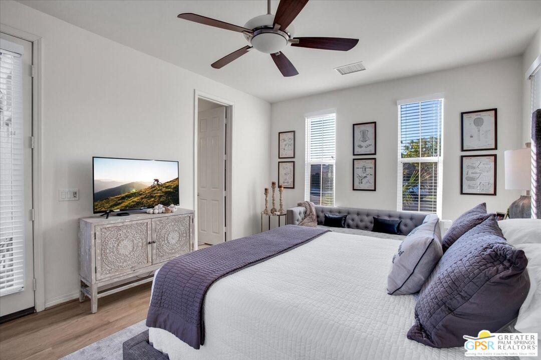 8 Lake Como Court Rancho Mirage, CA 92270 - Photo 8 of 63 a bedroom with a bed and a flat screen tv
