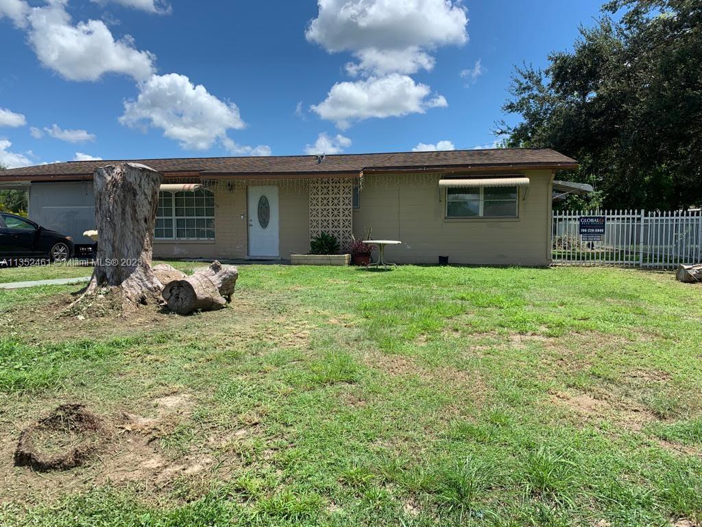 506 Jersey Road West Lehigh Acres, FL 33936 - Photo 7 of 10 a view of a house with backyard