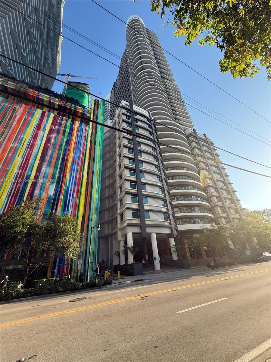 60 Southwest 13th Street, Unit 3017 Miami, FL 33130 - Photo 1 of 46 a view of a tall building next to a road
