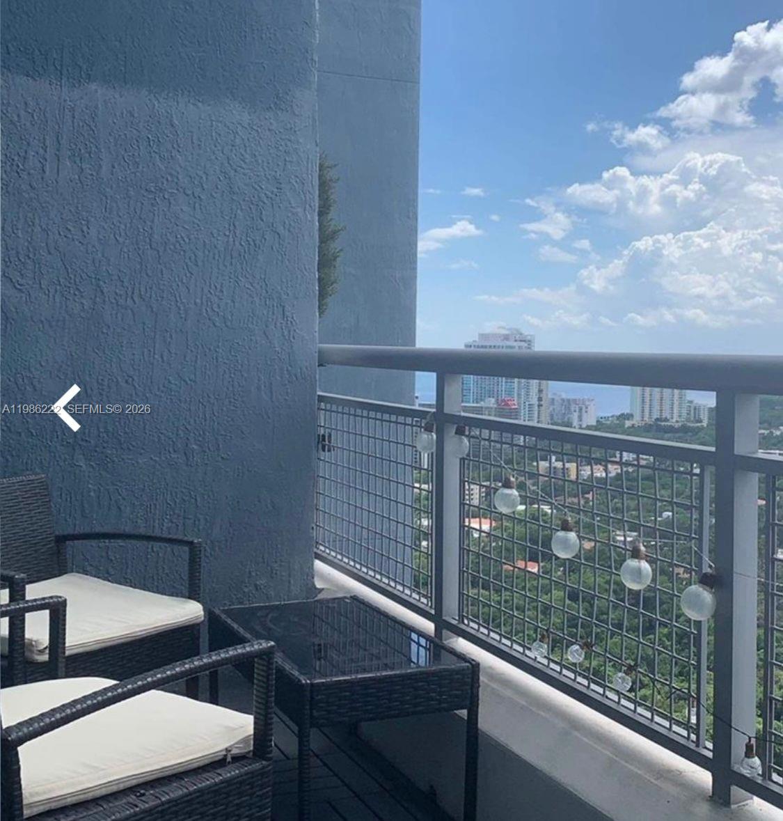 60 Southwest 13th Street, Unit 3017 Miami, FL 33130 - Photo 11 of 46 a view of a balcony with chairs