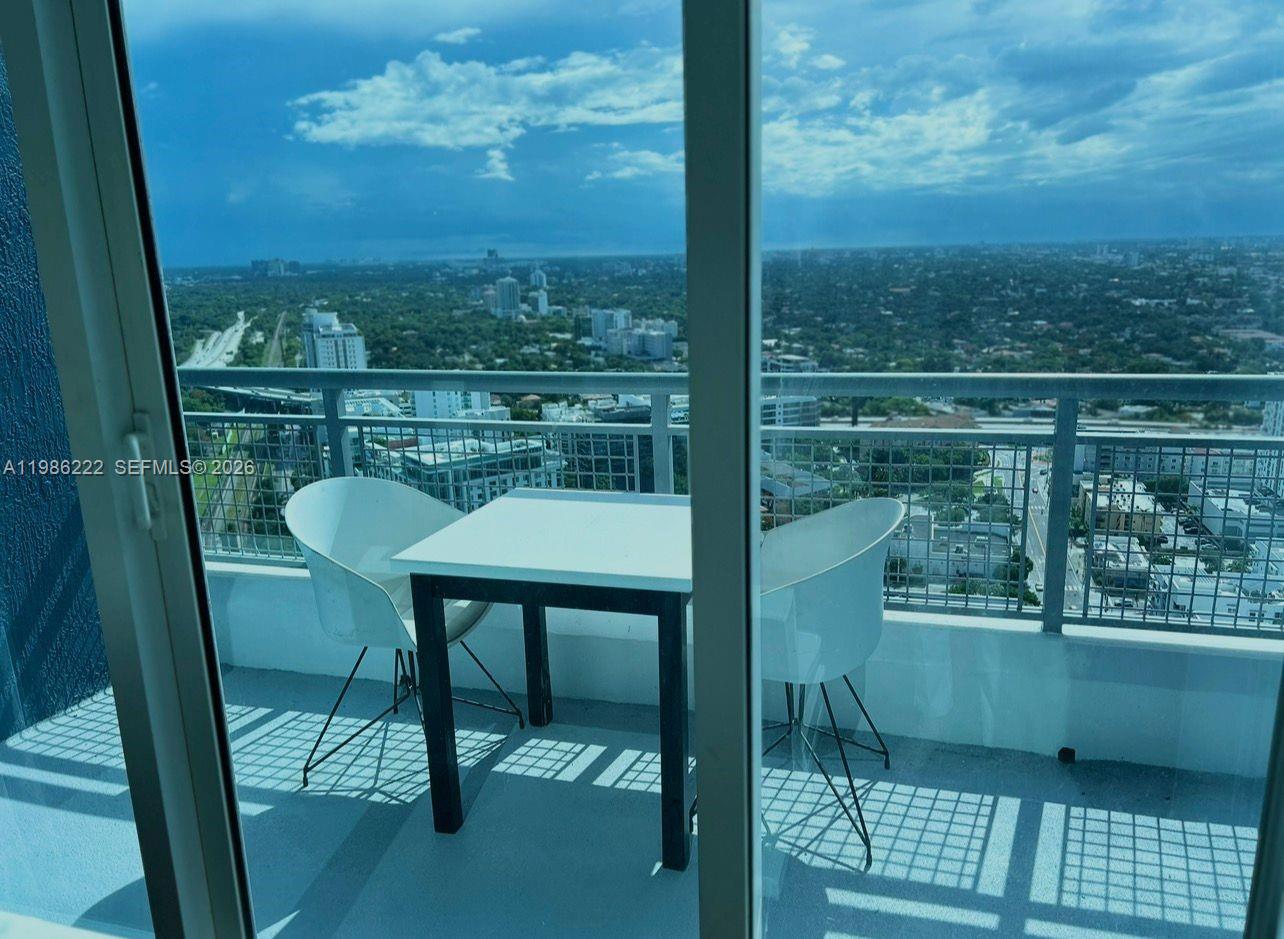 60 Southwest 13th Street, Unit 3017 Miami, FL 33130 - Photo 16 of 46 a view of a balcony with chair