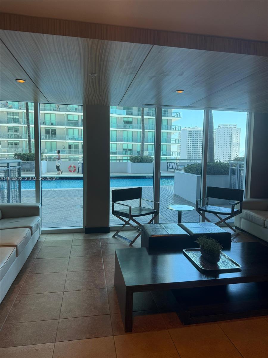 60 Southwest 13th Street, Unit 3017 Miami, FL 33130 - Photo 30 of 46 a view of a dining room with furniture window and outside view