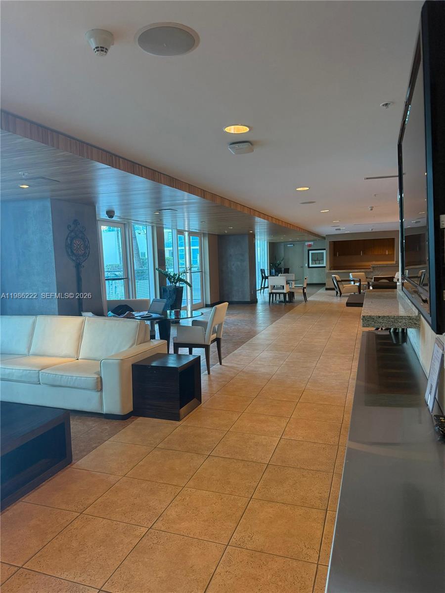 60 Southwest 13th Street, Unit 3017 Miami, FL 33130 - Photo 31 of 46 a lobby with furniture and a potted plant