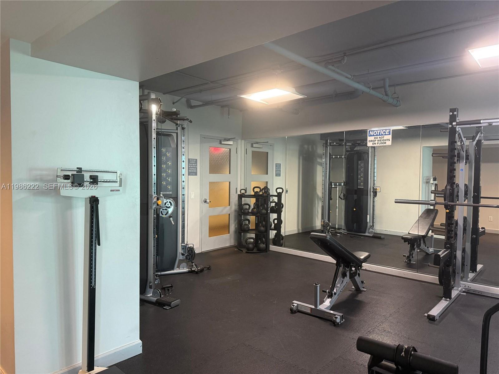 60 Southwest 13th Street, Unit 3017 Miami, FL 33130 - Photo 33 of 46 a view of a room with gym equipment