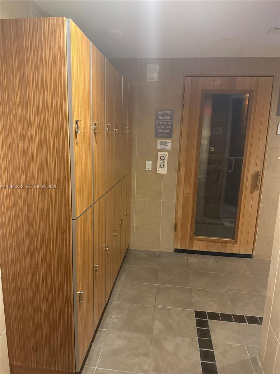 60 Southwest 13th Street, Unit 3017 Miami, FL 33130 - Photo 36 of 46 a view of a hallway with wooden floor