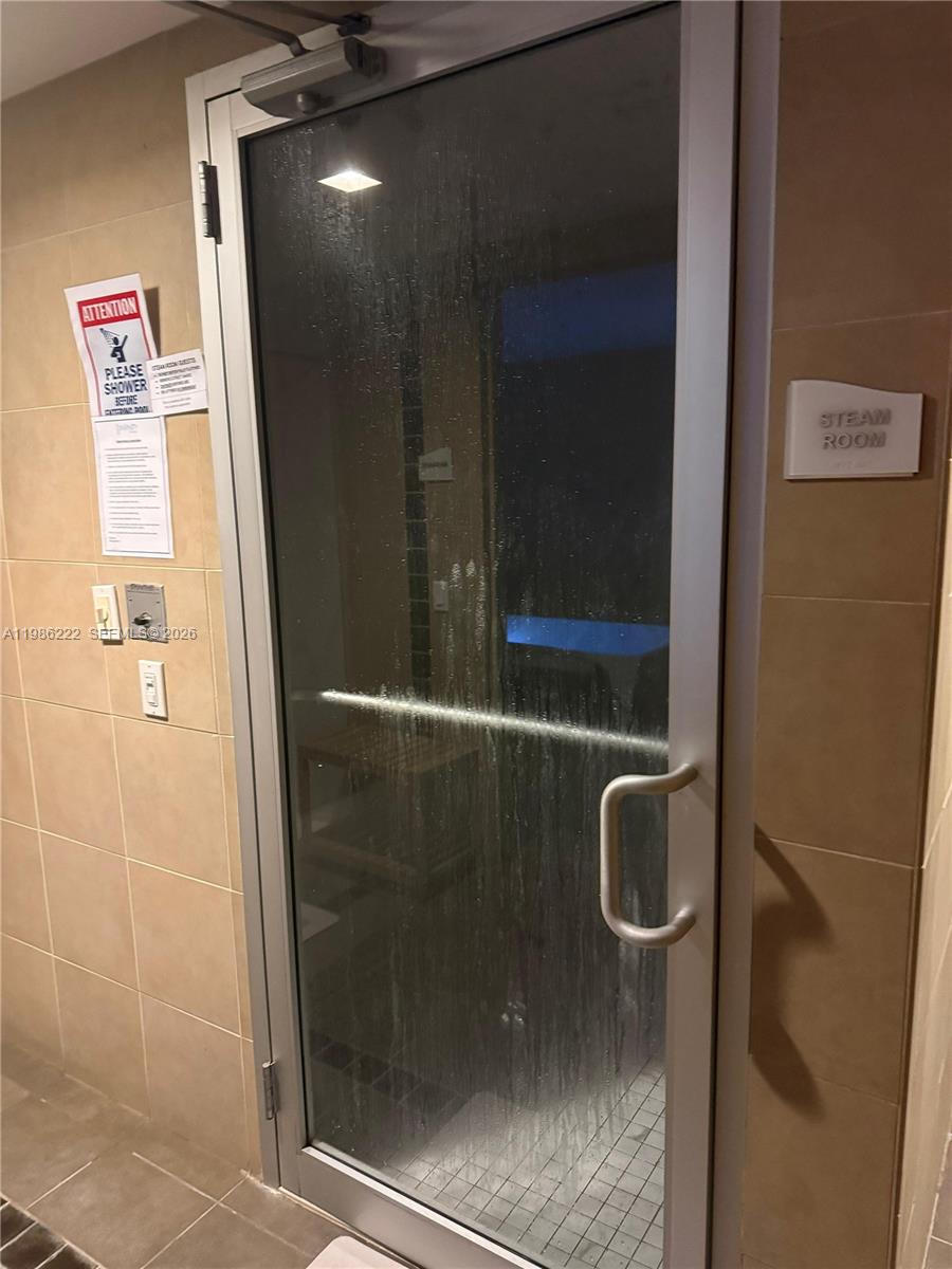 60 Southwest 13th Street, Unit 3017 Miami, FL 33130 - Photo 37 of 46 a bathroom with a shower