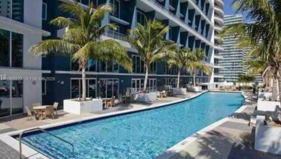 60 Southwest 13th Street, Unit 3017 Miami, FL 33130 - Photo 42 of 46 a view of a house with backyard and sitting area