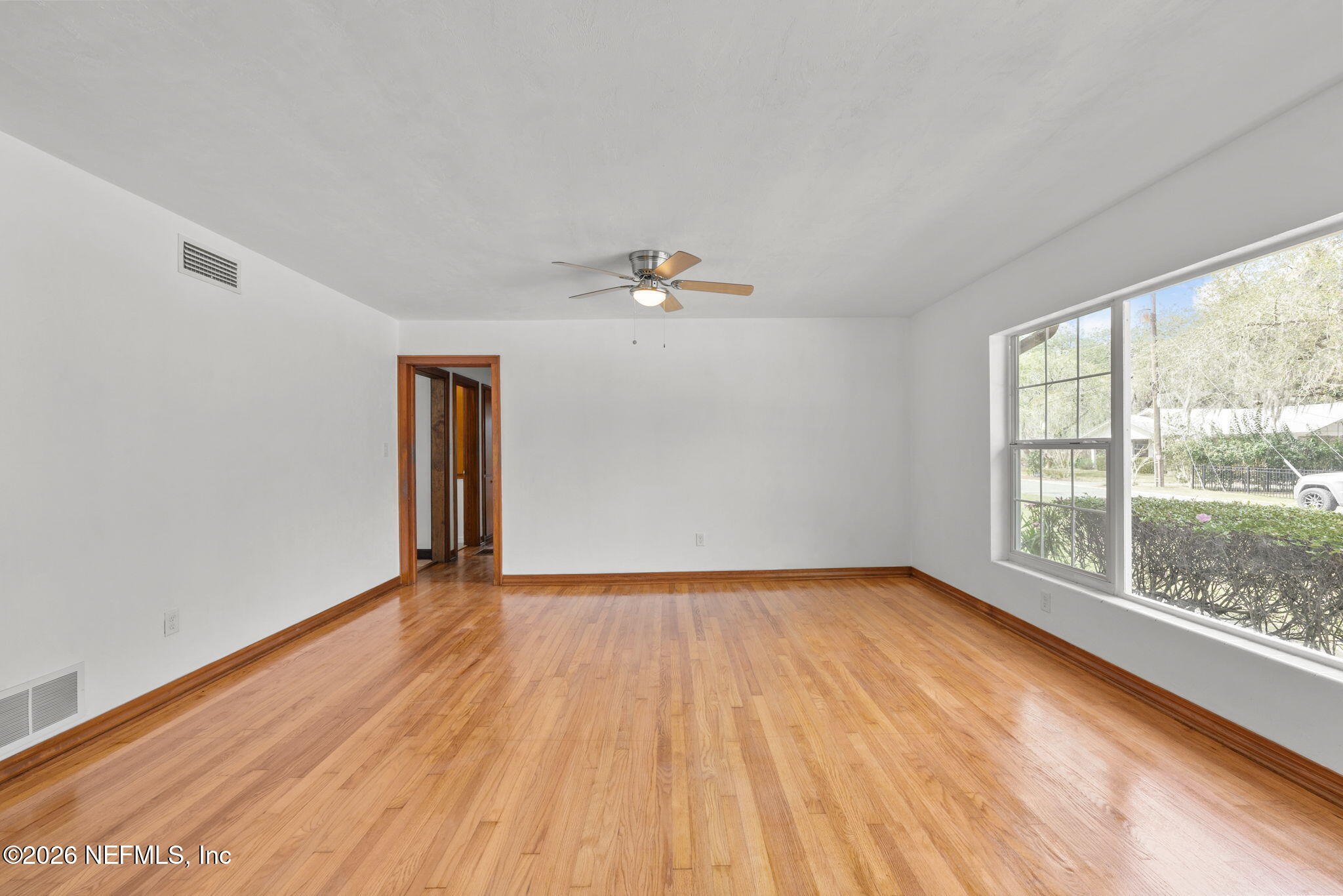 2003 Laurel Street Palatka, FL 32177 - Photo 9 of 31 a view of a livingroom with wooden floor and a window