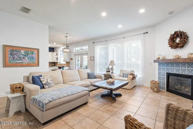 a spacious bedroom with a bed and a chair in it