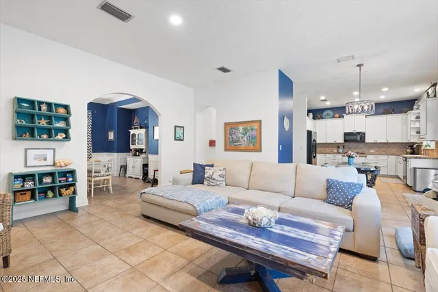 a bedroom with a bed and a television