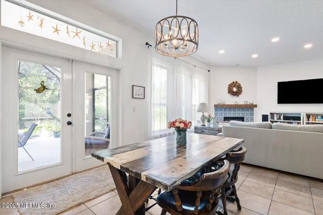 a view of a patio with a dining table and chairs