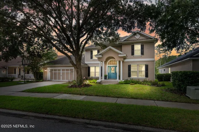 a front view of a house with a yard