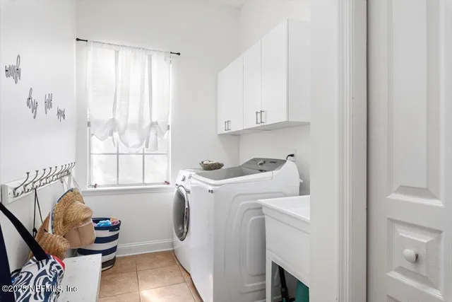 an aerial view of a house with garden space and a lake view