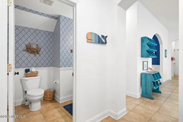 an aerial view of residential houses with outdoor space and street view