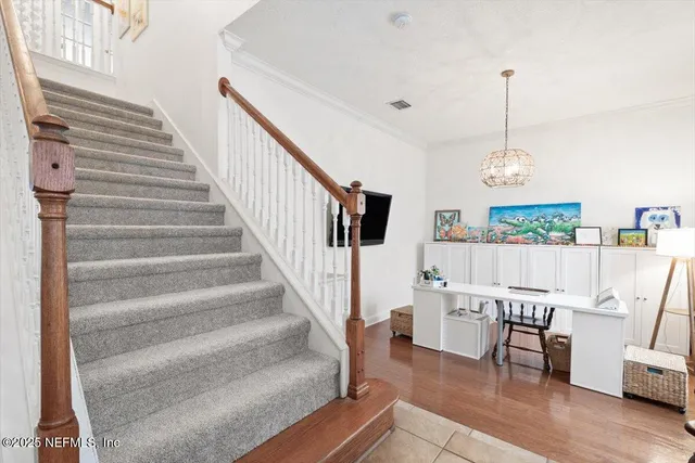 a view of a dining room with furniture and a window