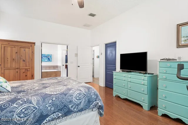 an aerial view of lake residential house with outdoor space and trees around