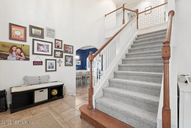 a bed room with a bed and a chandelier