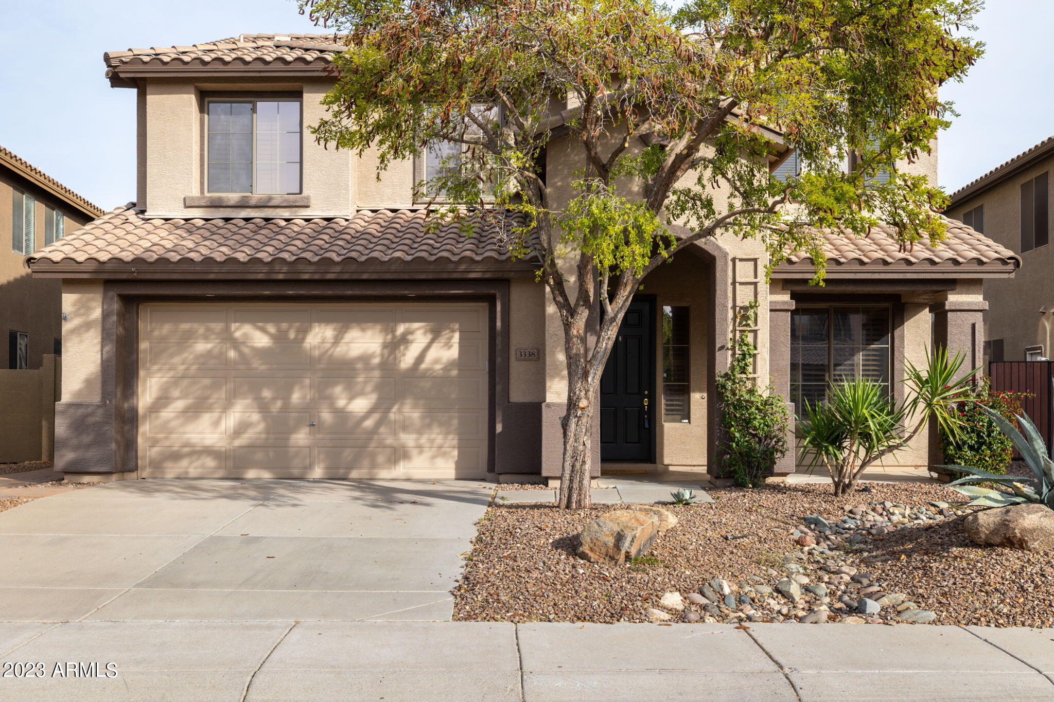 3338 West Hemingway Lane Phoenix, AZ 85086 - Photo 1 of 48 a front view of a house with a garden