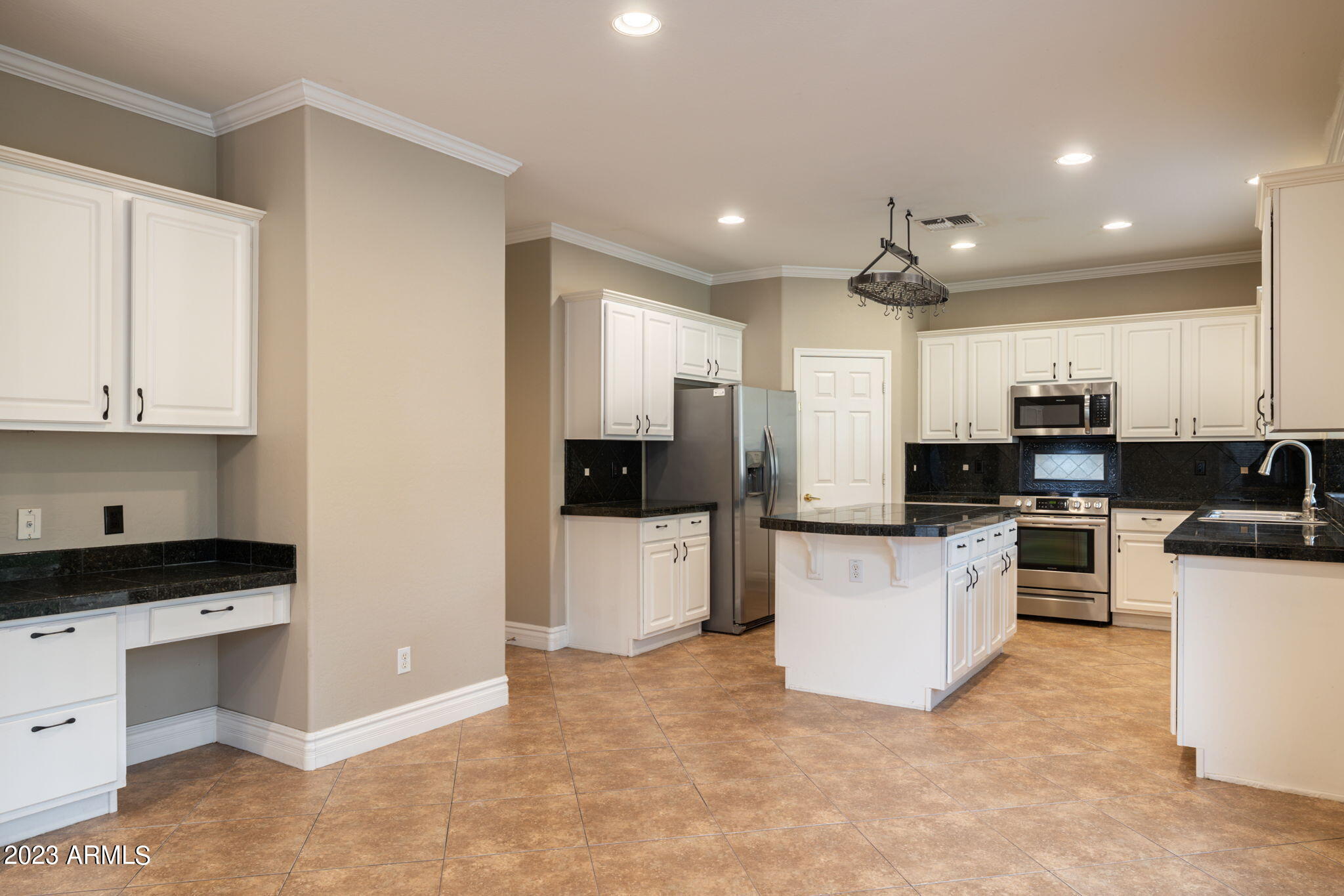 3338 West Hemingway Lane Phoenix, AZ 85086 - Photo 12 of 48 a kitchen with refrigerator and stove