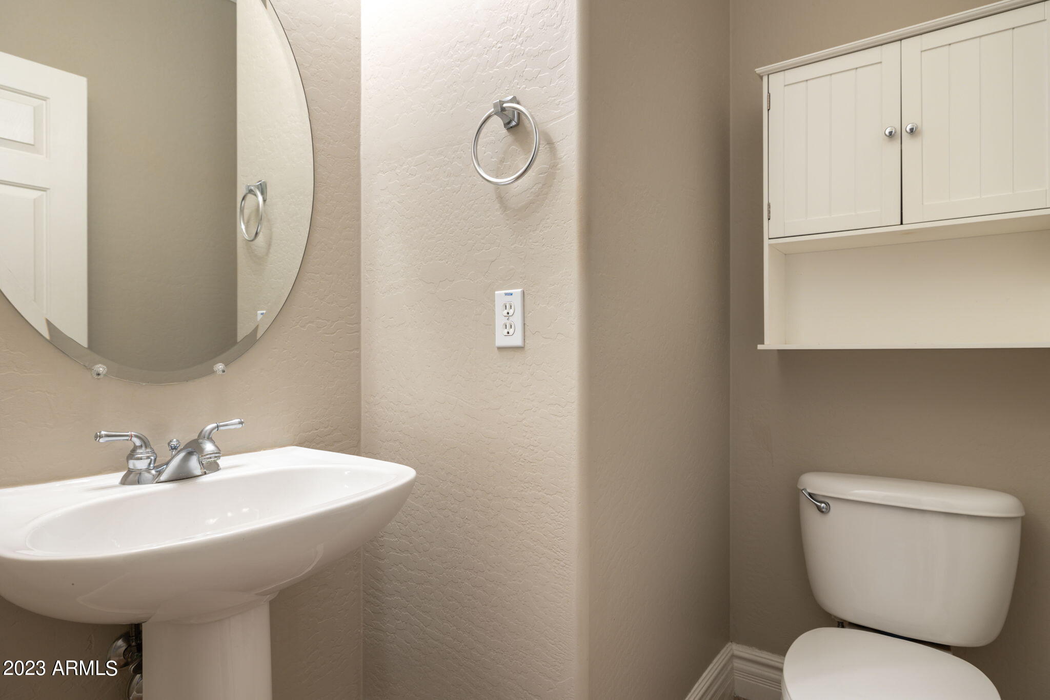 3338 West Hemingway Lane Phoenix, AZ 85086 - Photo 18 of 48 a bathroom with a toilet sink and mirror