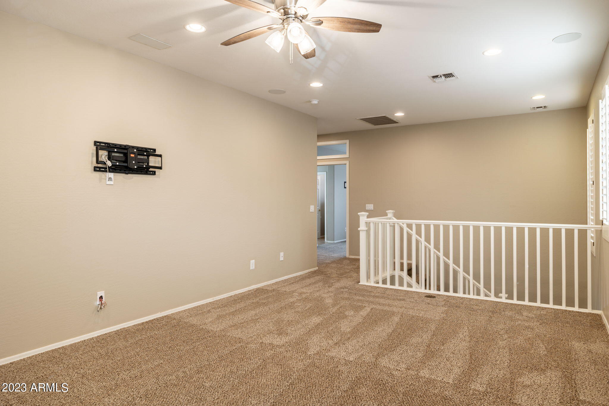 3338 West Hemingway Lane Phoenix, AZ 85086 - Photo 23 of 48 an empty room with fan and windows