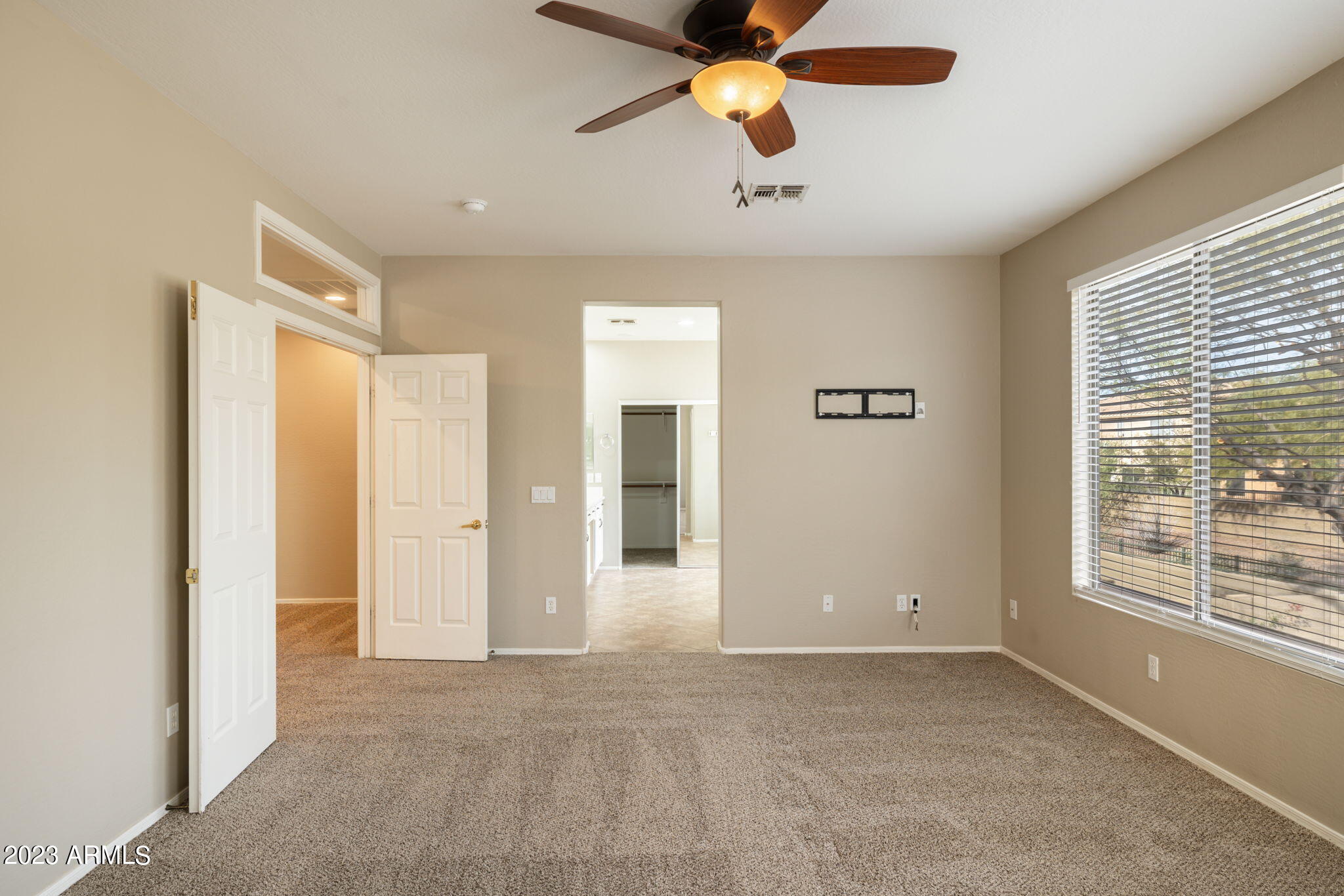 3338 West Hemingway Lane Phoenix, AZ 85086 - Photo 27 of 48 a view of a livingroom with a ceiling fan and window