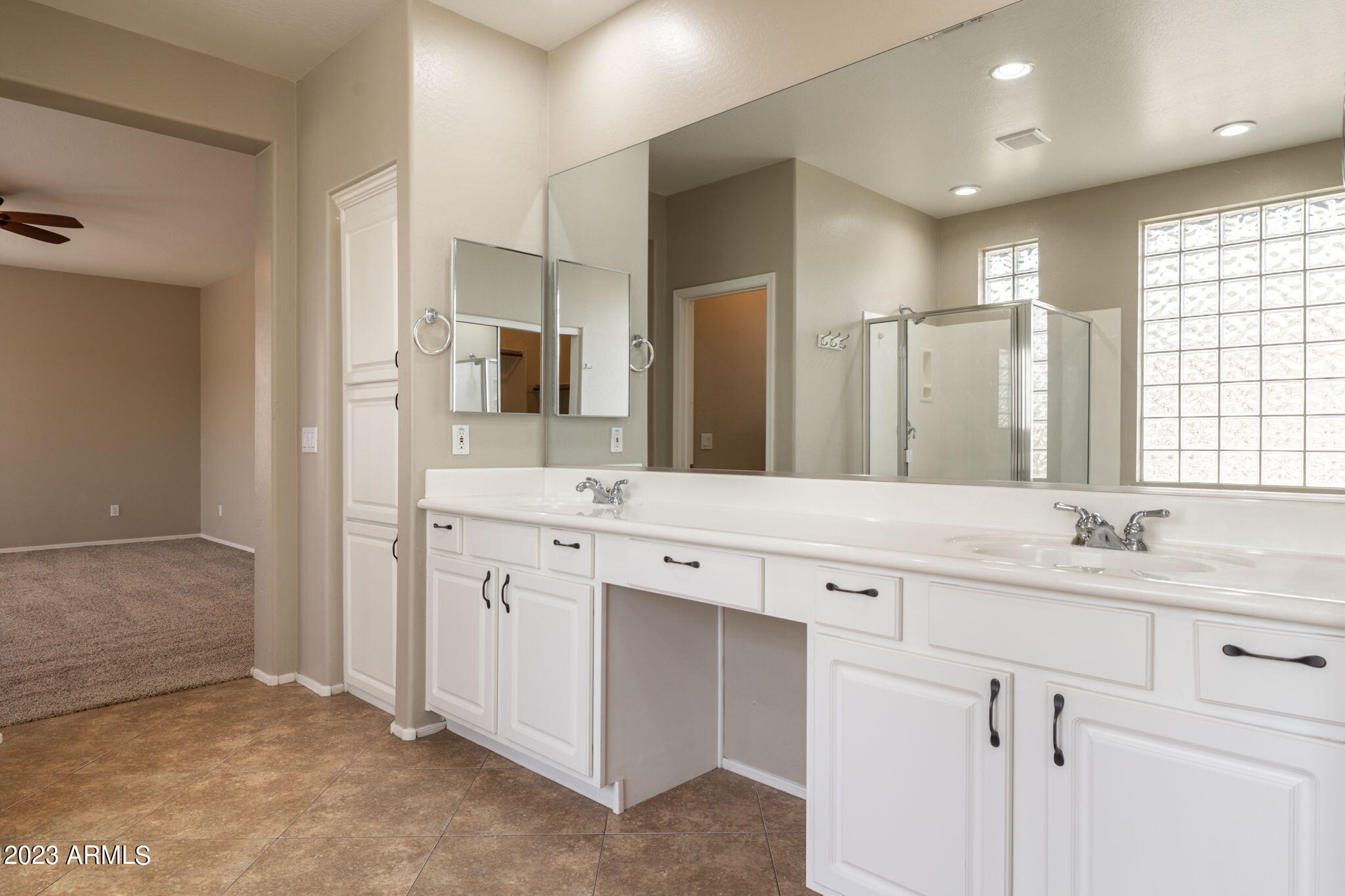 3338 West Hemingway Lane Phoenix, AZ 85086 - Photo 29 of 48 a bathroom with a double vanity sink and mirror