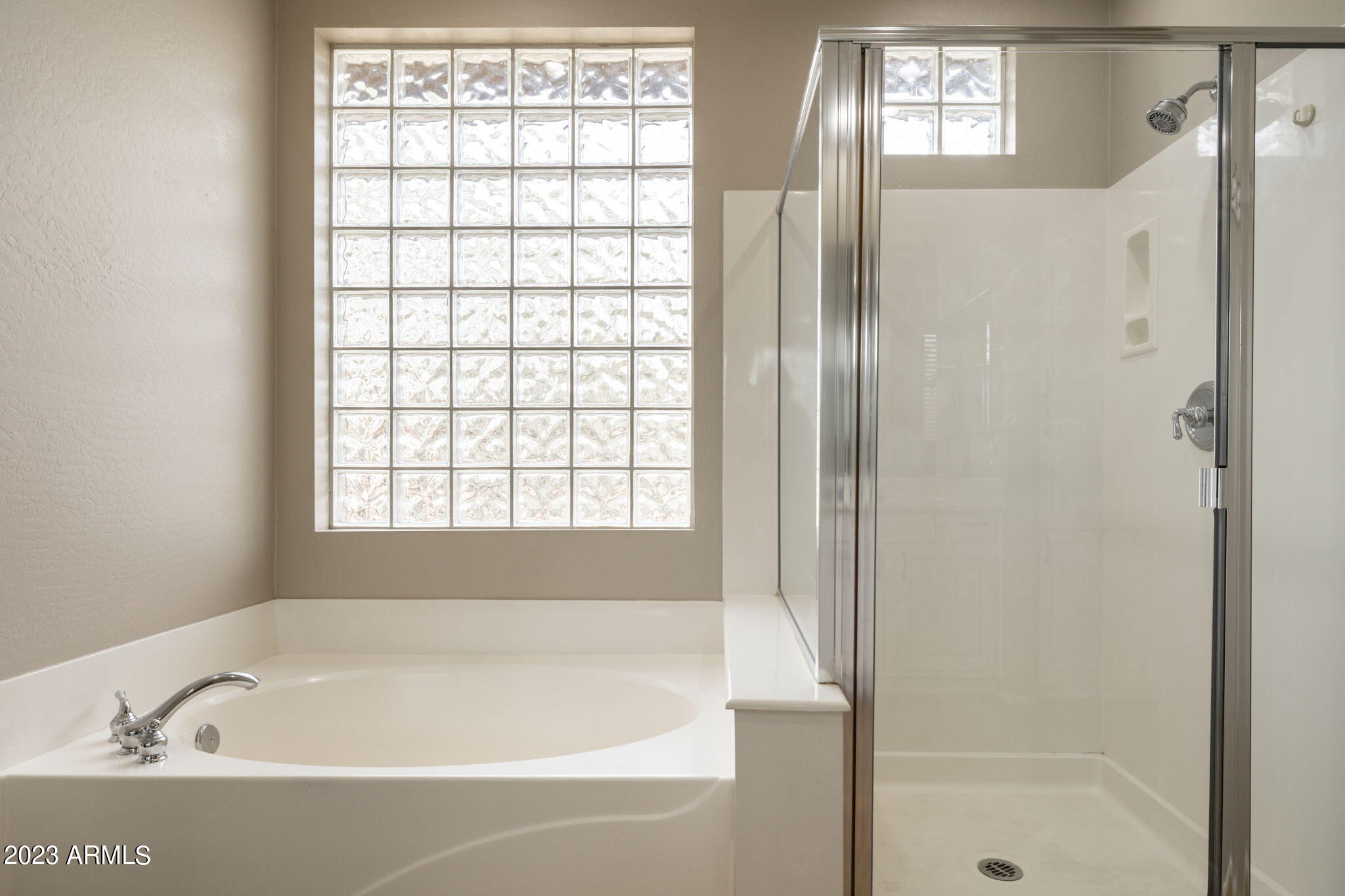 3338 West Hemingway Lane Phoenix, AZ 85086 - Photo 30 of 48 a white bath tub sitting next to a shower