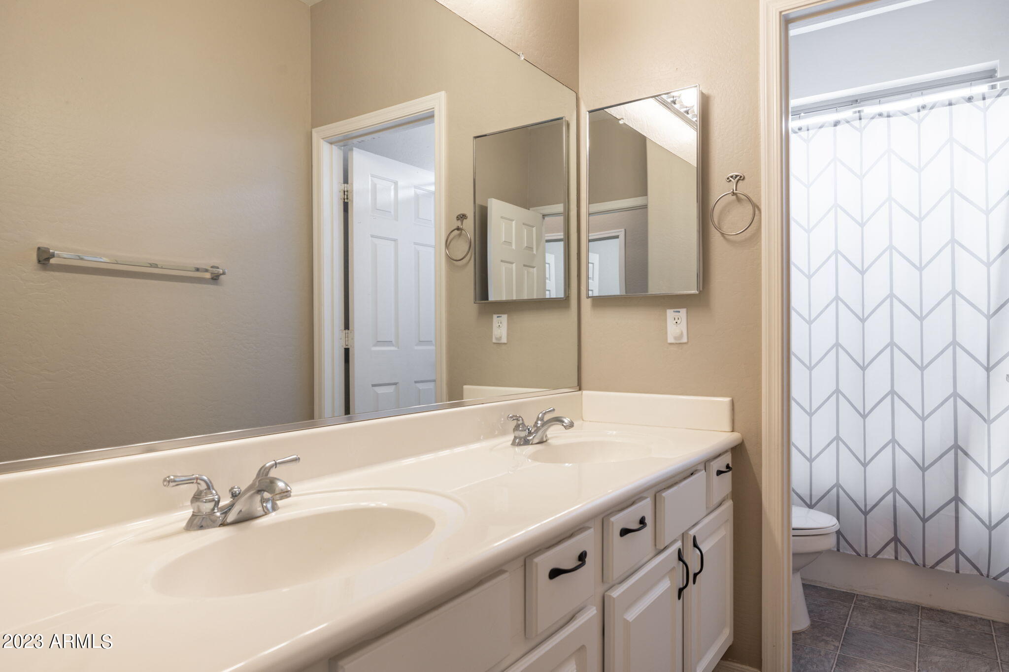 3338 West Hemingway Lane Phoenix, AZ 85086 - Photo 39 of 48 a bathroom with a sink and a mirror