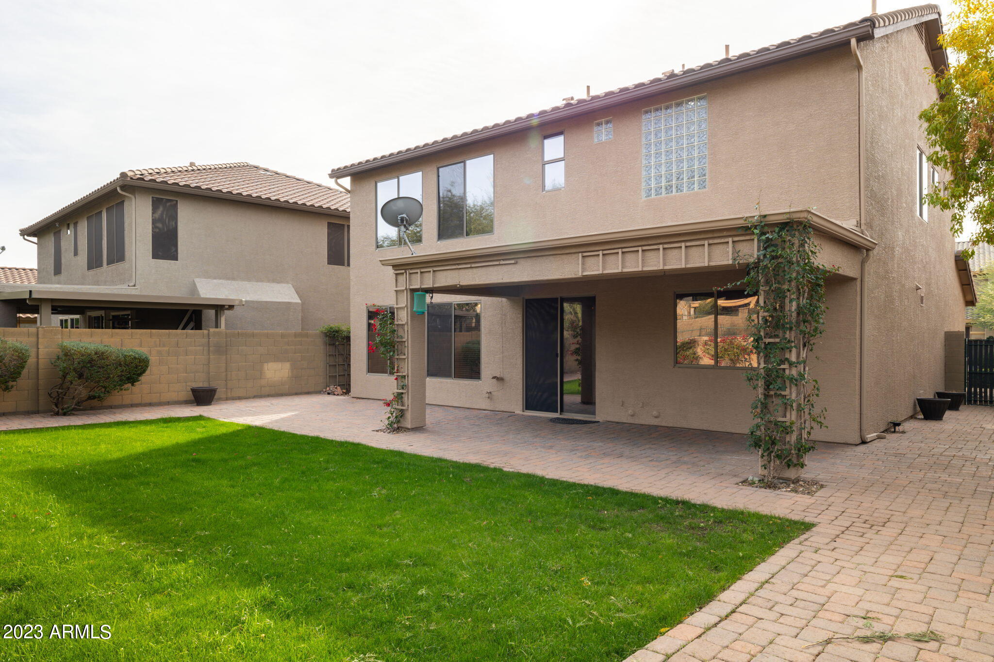 3338 West Hemingway Lane Phoenix, AZ 85086 - Photo 41 of 48 a front view of a house with a garden and plants