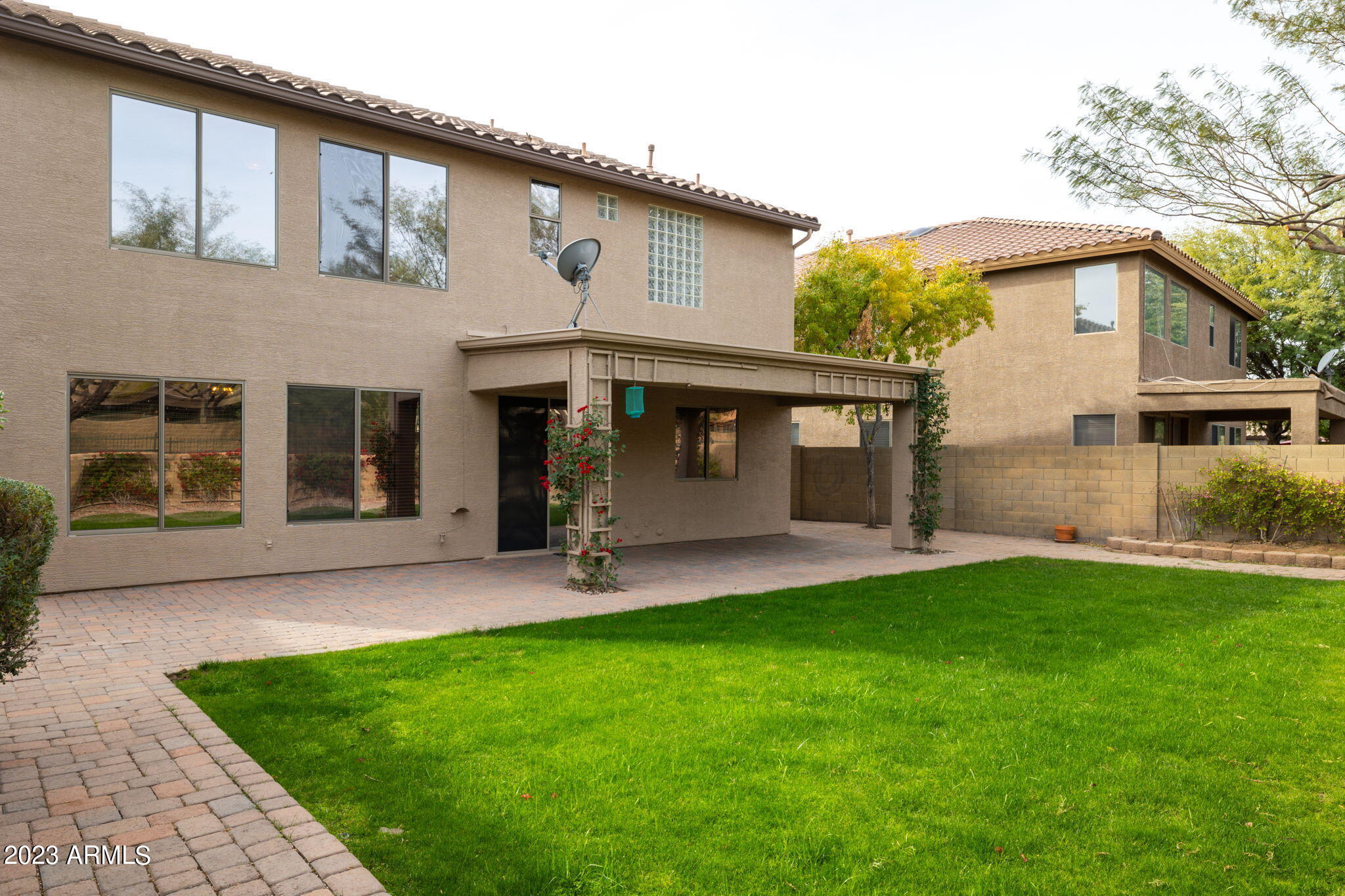3338 West Hemingway Lane Phoenix, AZ 85086 - Photo 42 of 48 a front view of a house with a garden and yard