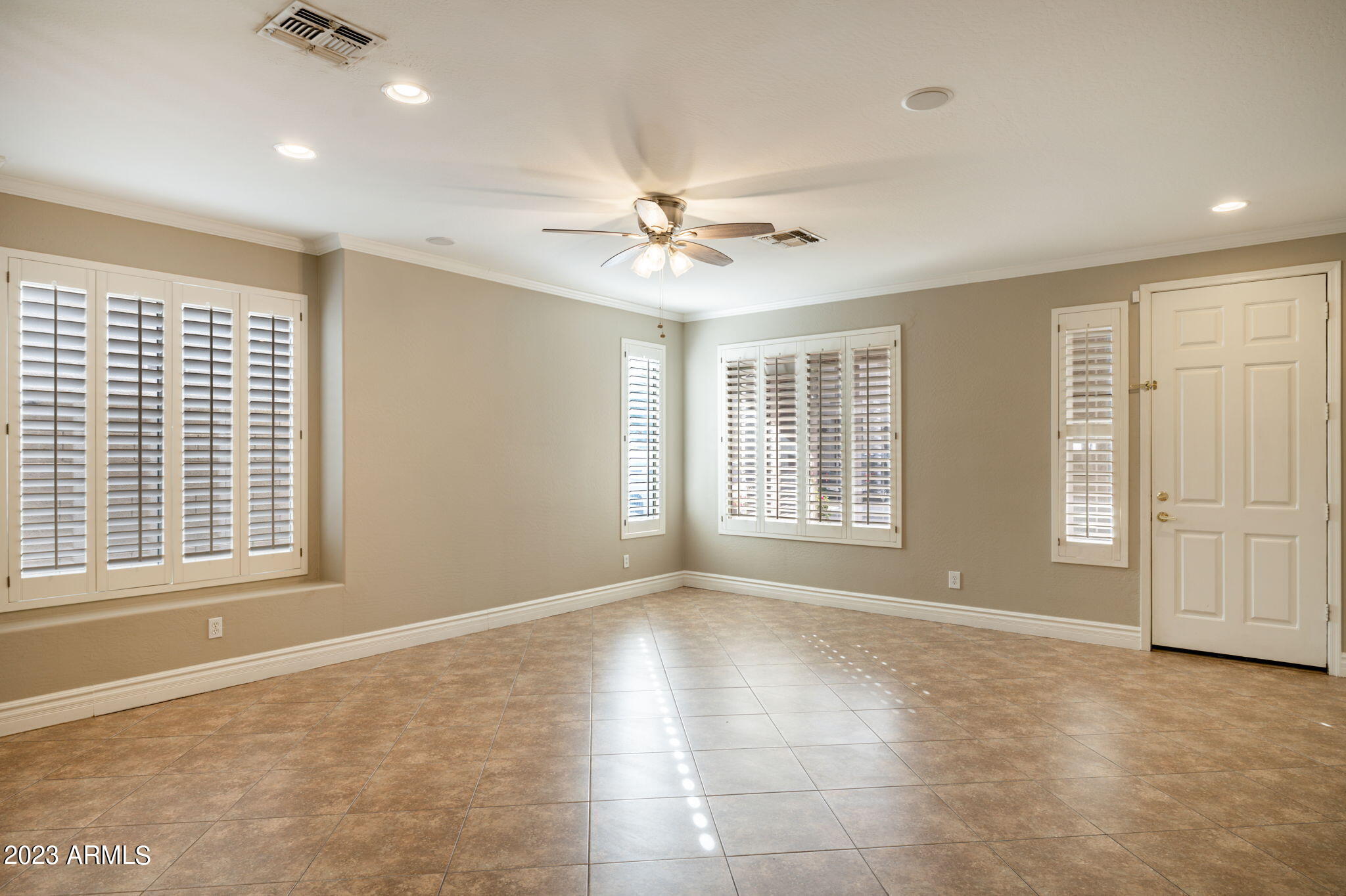 3338 West Hemingway Lane Phoenix, AZ 85086 - Photo 5 of 48 a view of an empty room with a window