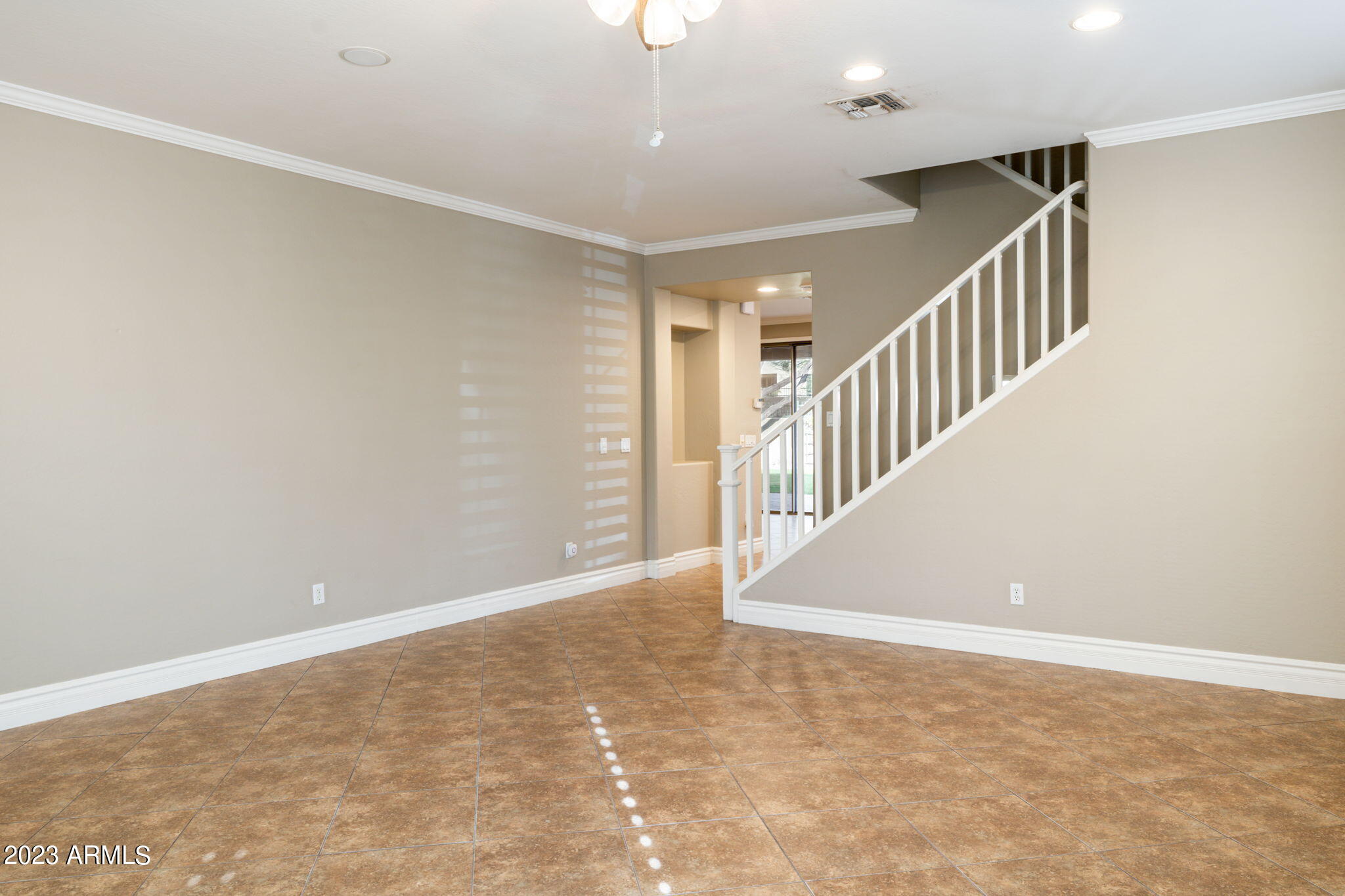 3338 West Hemingway Lane Phoenix, AZ 85086 - Photo 6 of 48 a view of an empty room with stairs