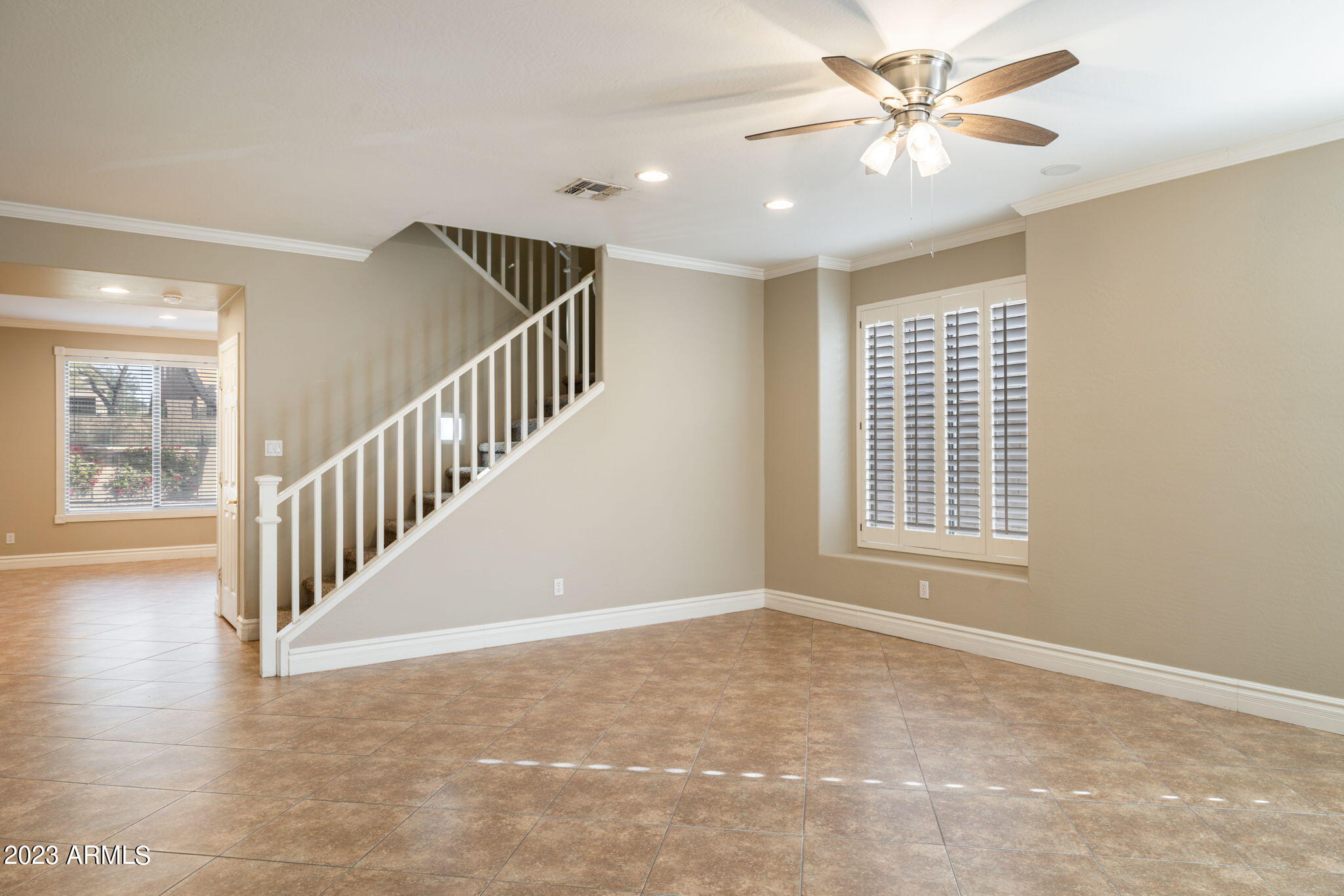 3338 West Hemingway Lane Phoenix, AZ 85086 - Photo 7 of 48 a view of an empty room with a window