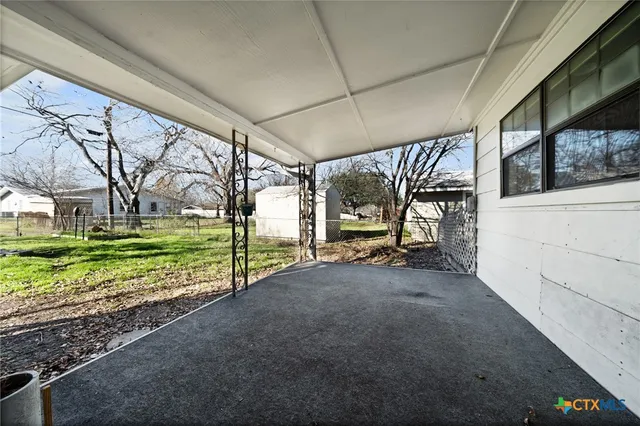 a view of a house with a big yard