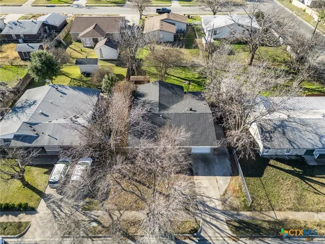 a buildings covered with tall trees