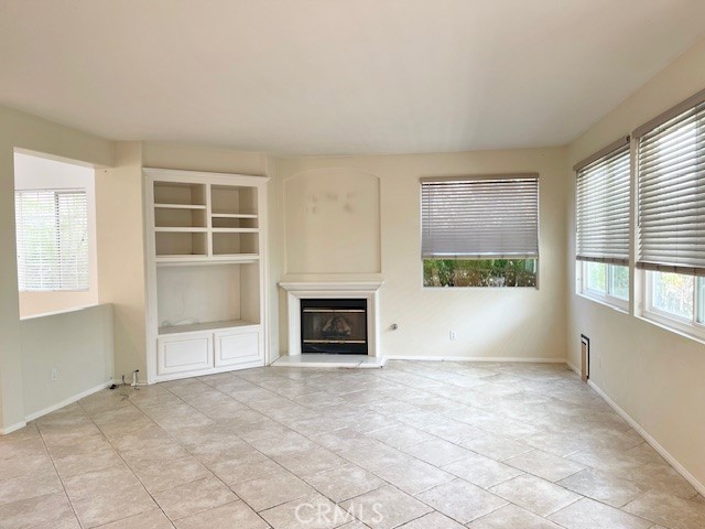 45360 Vista Verde Temecula, CA 92592 - Photo 9 of 23 an empty room with furniture and a fireplace