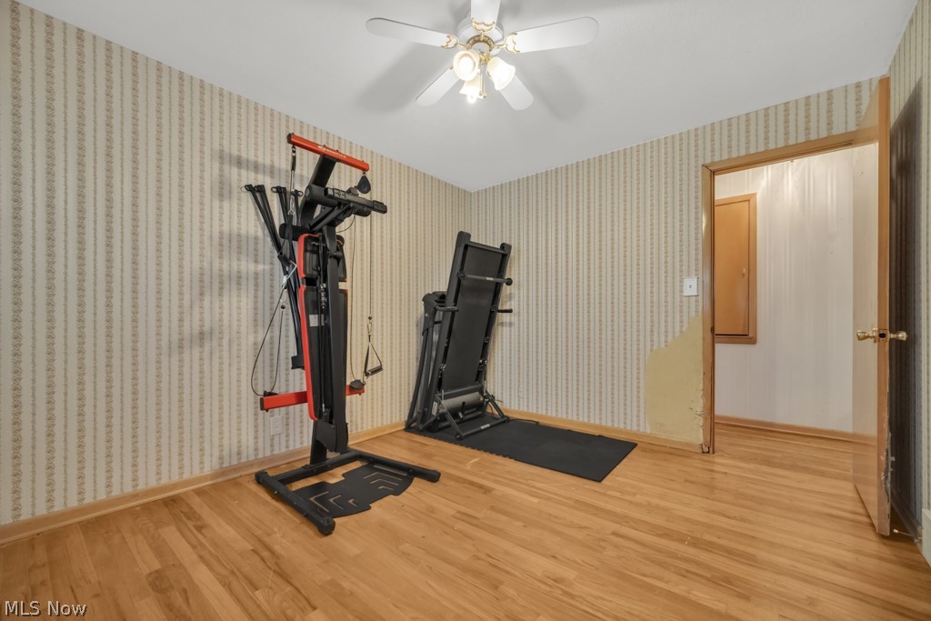 6846 Revere Road Cleveland, OH 44130 - Photo 17 of 30 Workout room featuring wood finished floors and ceiling fan