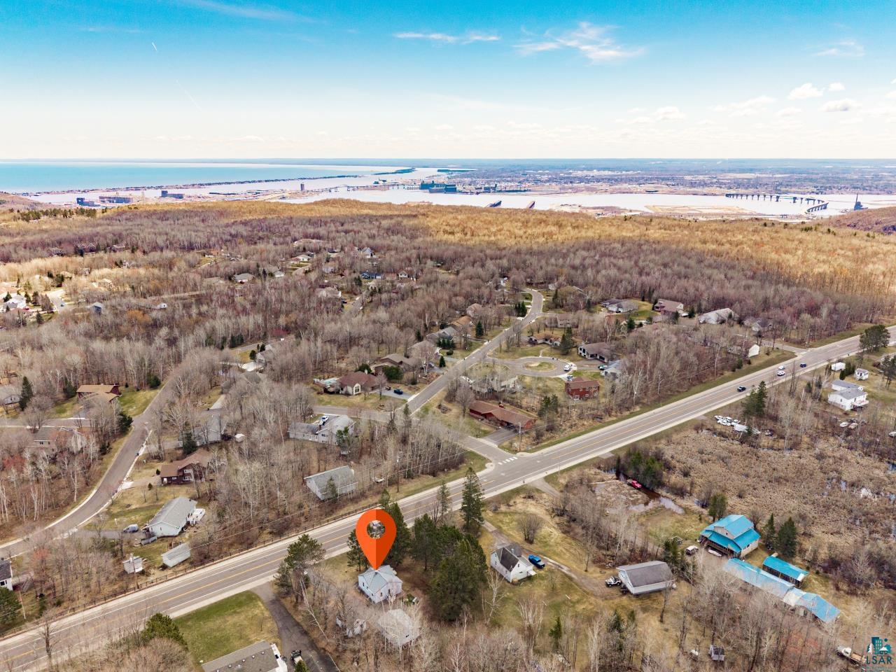 3645 Haines Road Hermantown, MN 55811 - Photo 7 of 35 Aerial view highlighting a property situated roadside with expansive natural surroundings