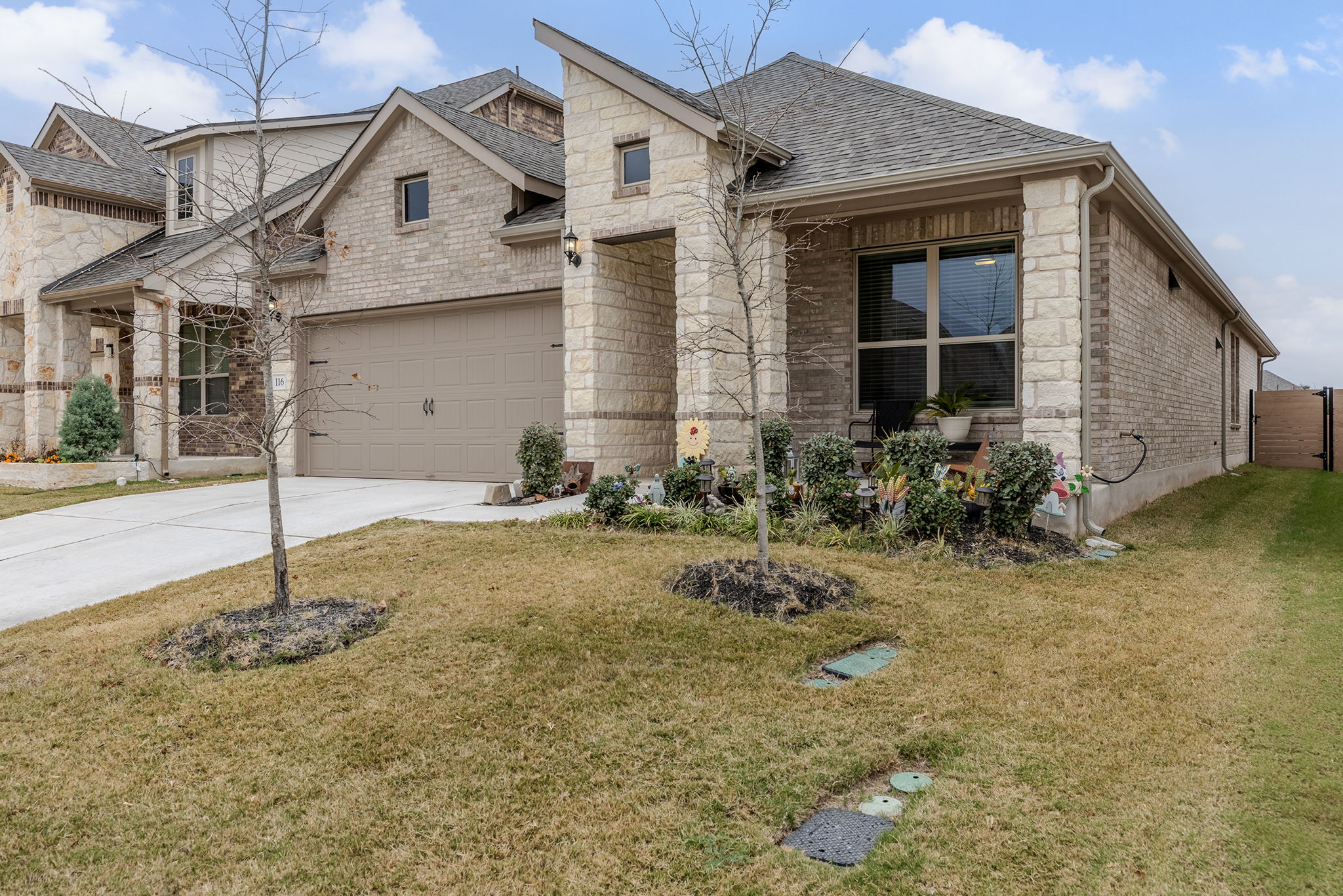 116 Raleigh Drive Georgetown, TX 78633 - Photo 2 of 28 A handsome stone and brick facade welcomes you home to this meticulously maintained residence.