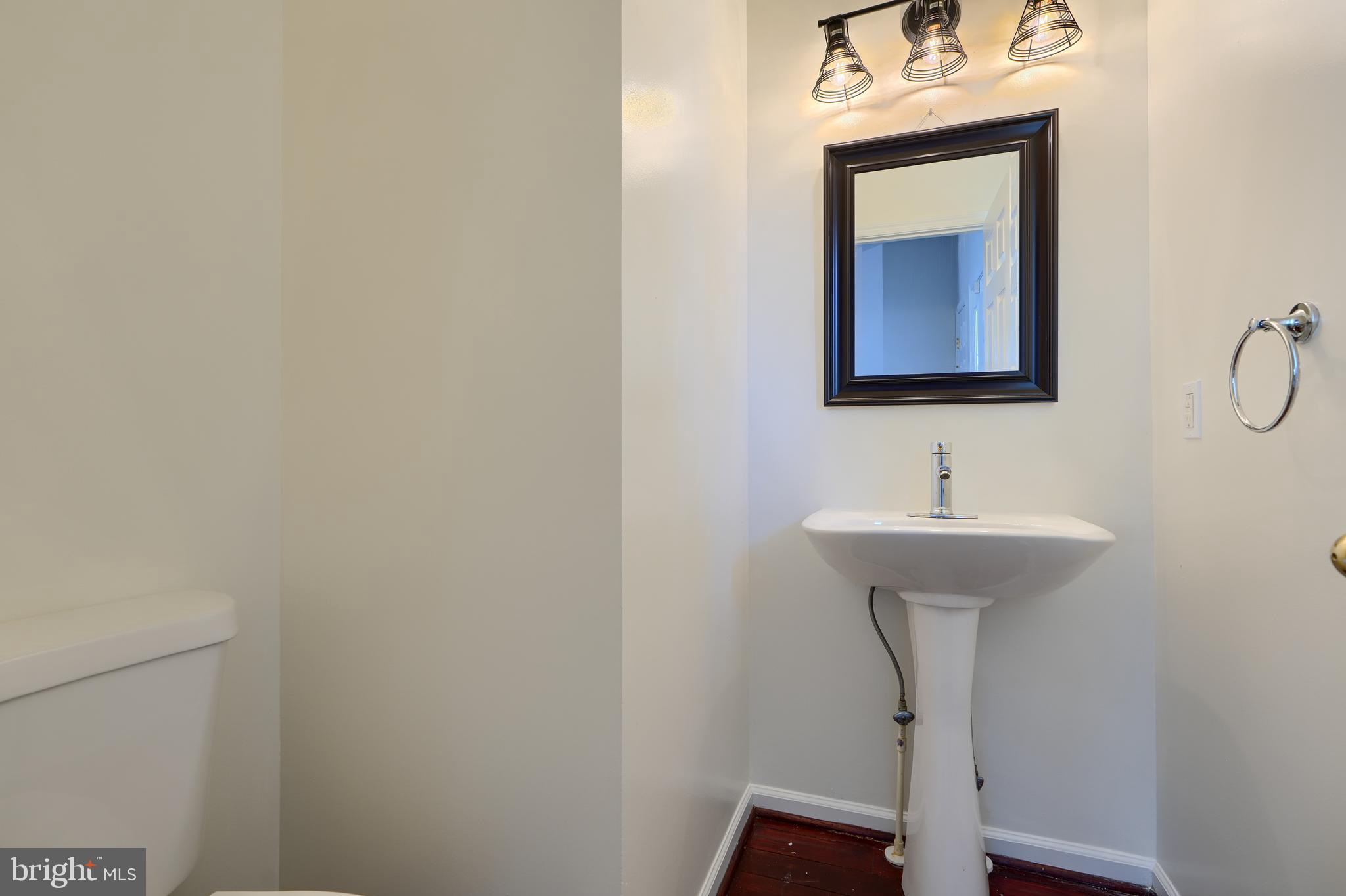 724 Tinker Road Middle River, MD 21220 - Photo 19 of 68 a bathroom with a sink and mirror