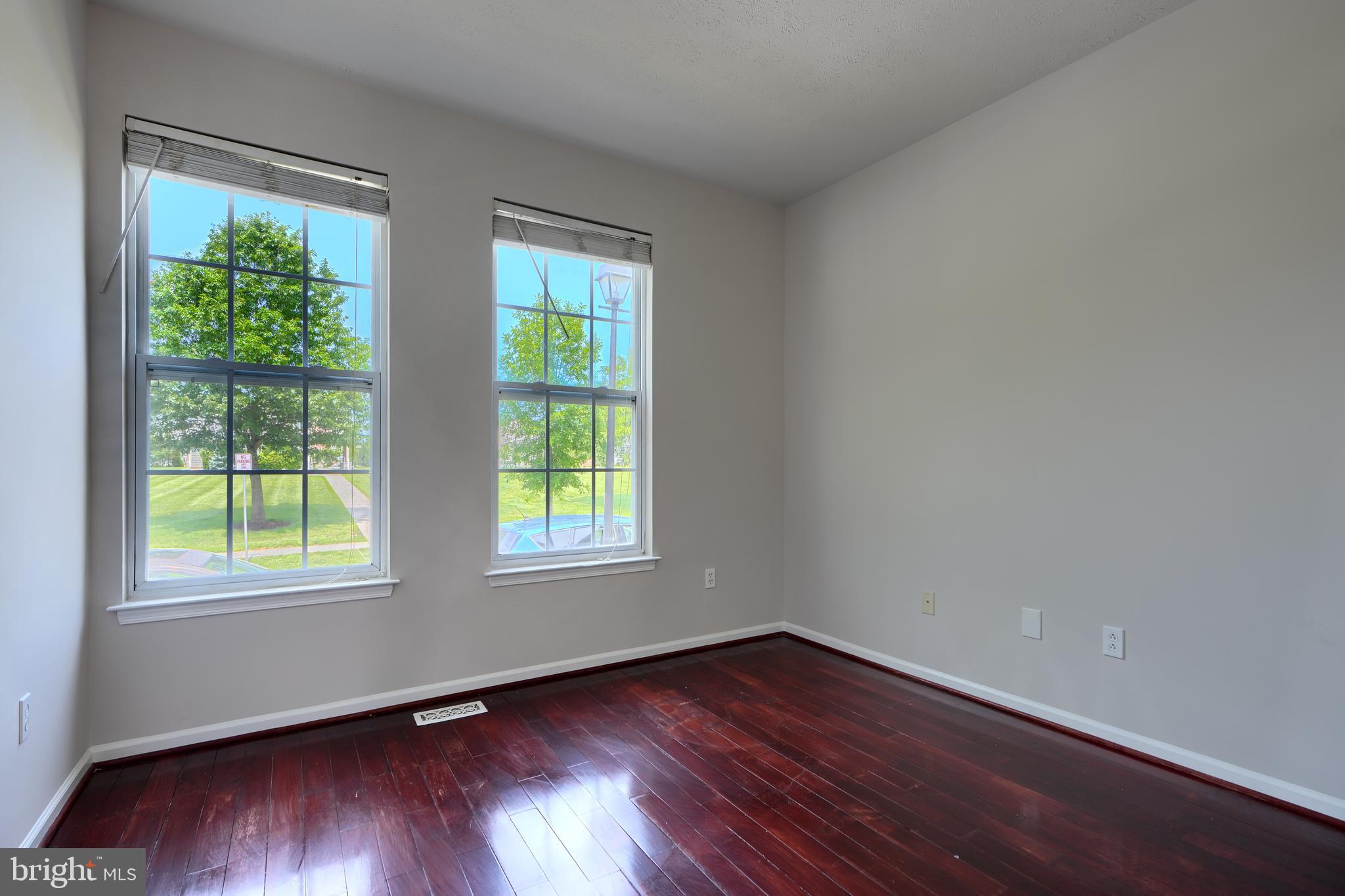 724 Tinker Road Middle River, MD 21220 - Photo 3 of 68 an empty room with wooden floor and windows