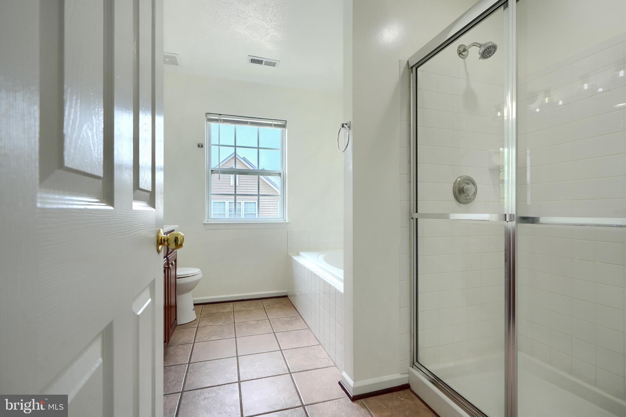 724 Tinker Road Middle River, MD 21220 - Photo 44 of 68 a bathroom with a bathtub and a shower