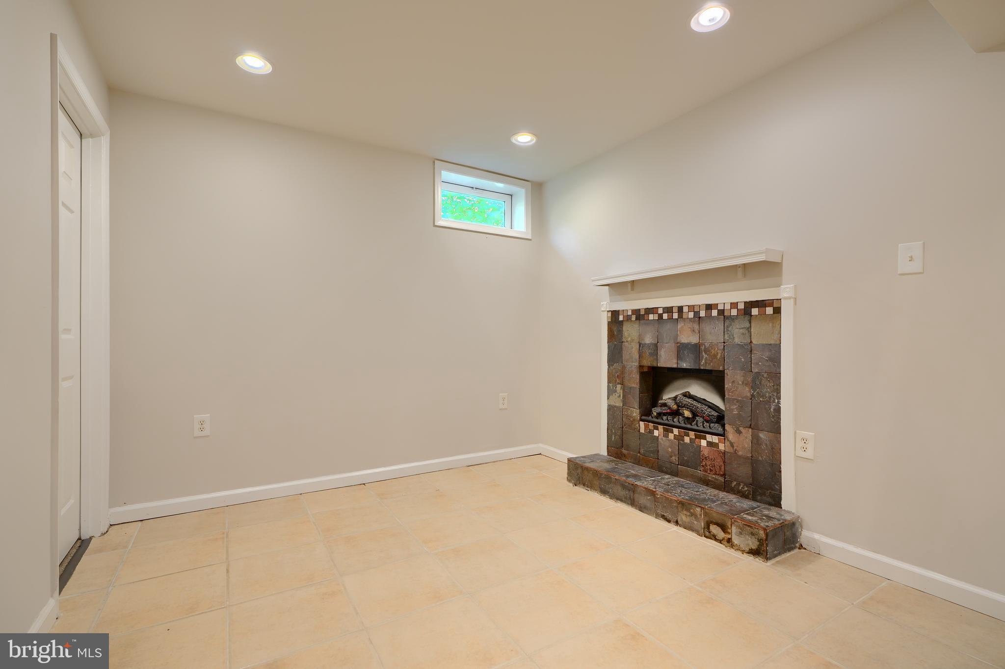 724 Tinker Road Middle River, MD 21220 - Photo 52 of 68 an empty room with a fireplace