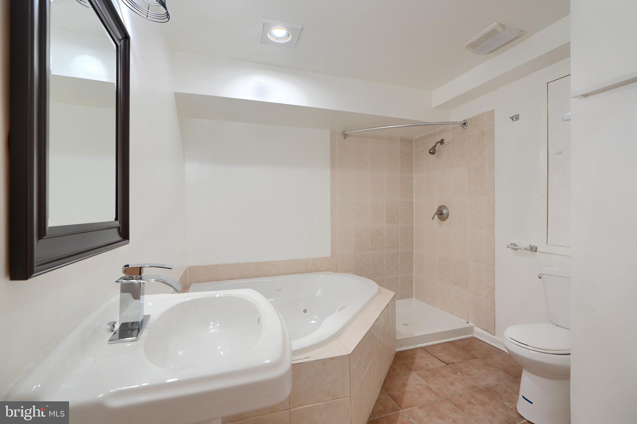 724 Tinker Road Middle River, MD 21220 - Photo 58 of 68 a bathroom with a sink a toilet and shower