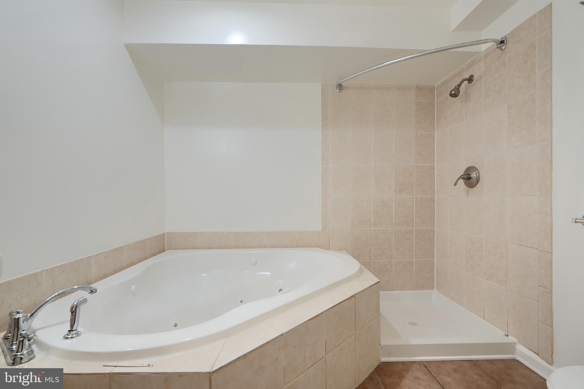 724 Tinker Road Middle River, MD 21220 - Photo 60 of 68 a white bath tub sitting in a bathroom