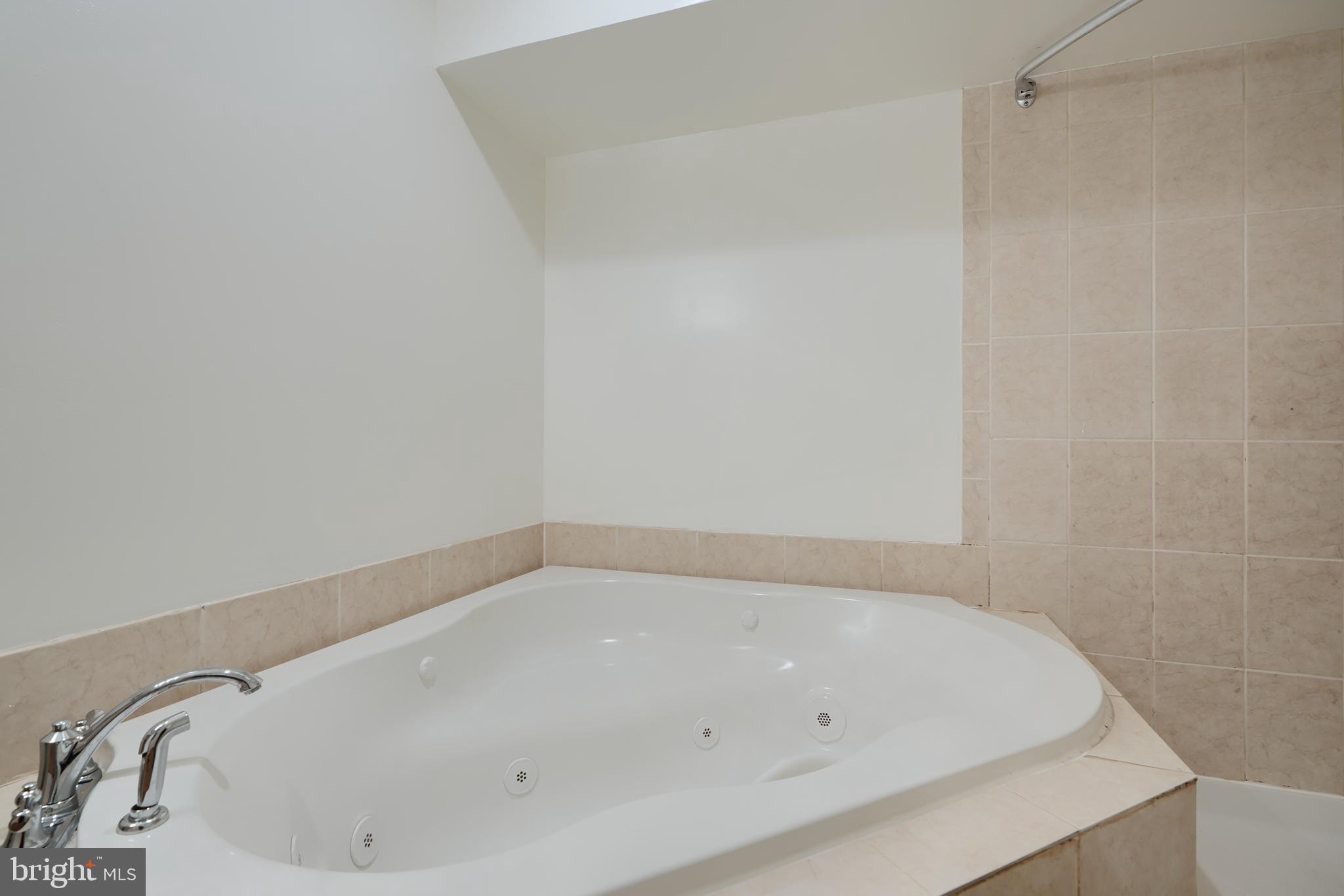 724 Tinker Road Middle River, MD 21220 - Photo 61 of 68 a white bath tub sitting in a bathroom