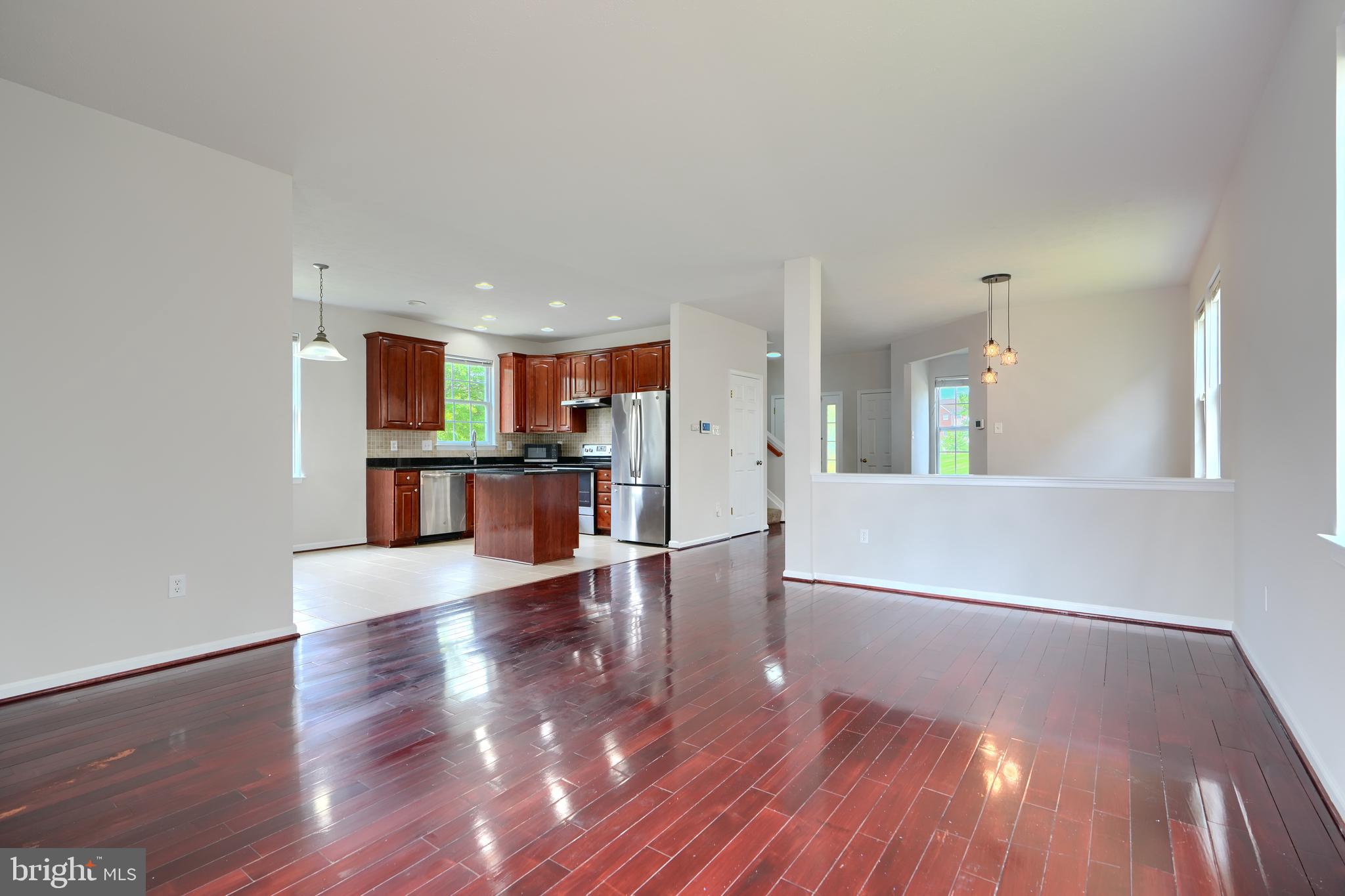 724 Tinker Road Middle River, MD 21220 - Photo 9 of 68 a view of a kitchen with wooden floor and a kitchen
