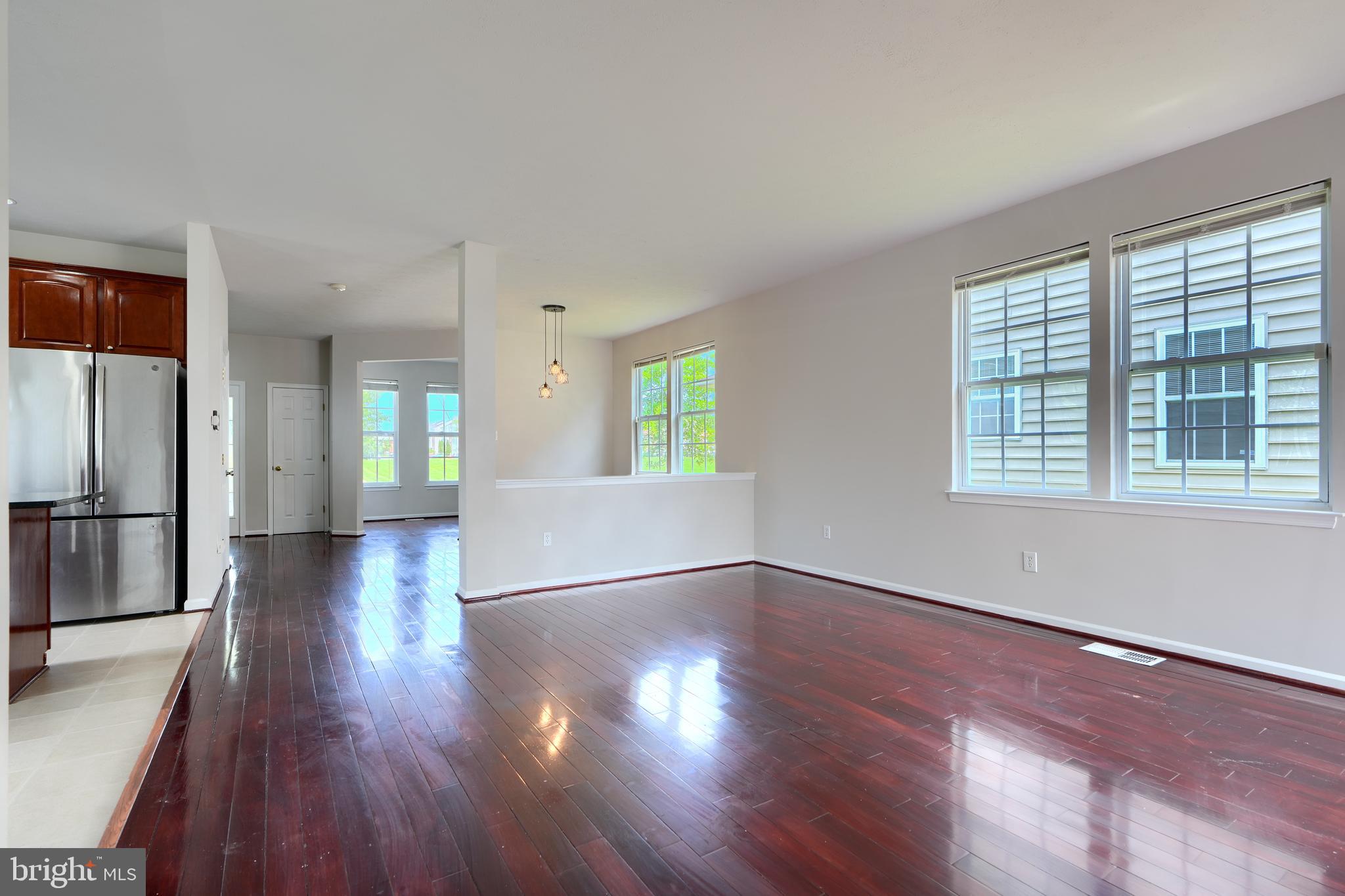 724 Tinker Road Middle River, MD 21220 - Photo 10 of 68 a view of an empty room with wooden floor and a window