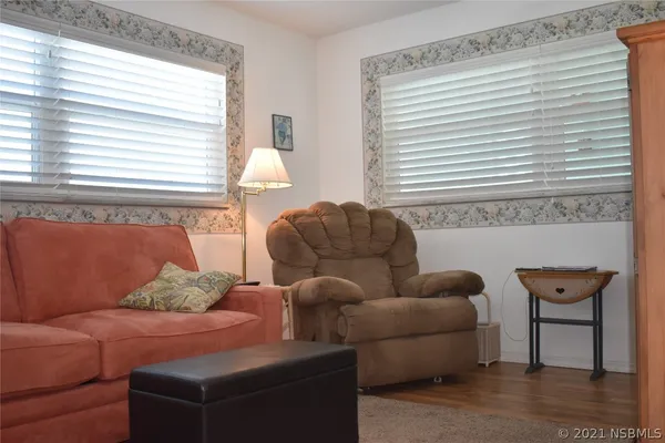 a living room with furniture and a window